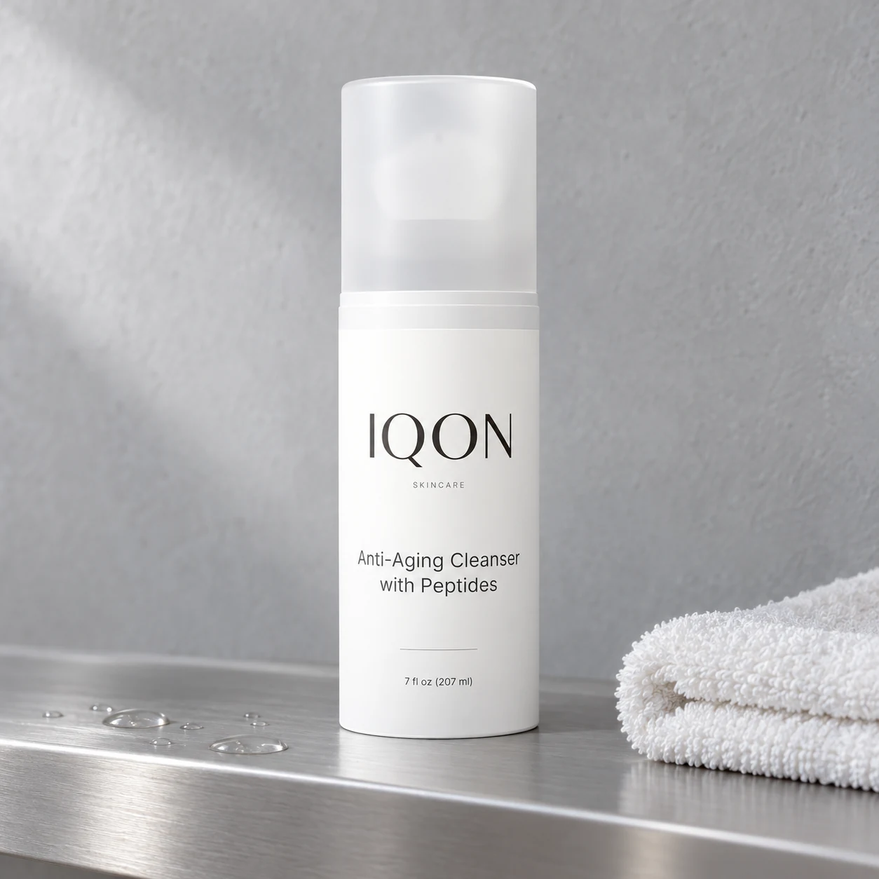 IQON peptide cleanser with a cotton cloth on a silver shelf