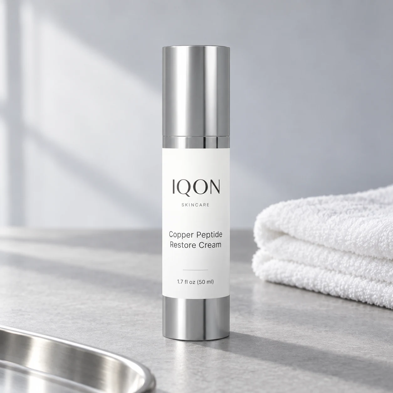 IQON Copper Peptide Restore Cream with a white cotton cloth