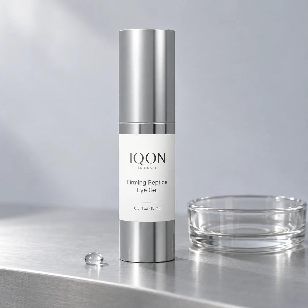 IQON Firming Peptide Eye Gel with a clear glass dish on a silver ledge