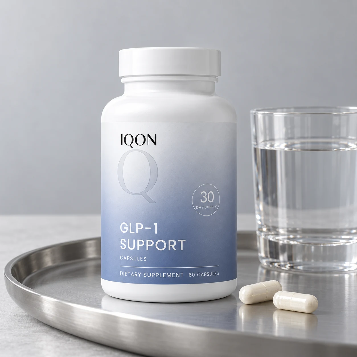 IQON GLP-1 Support on a silver tray with capsules and water