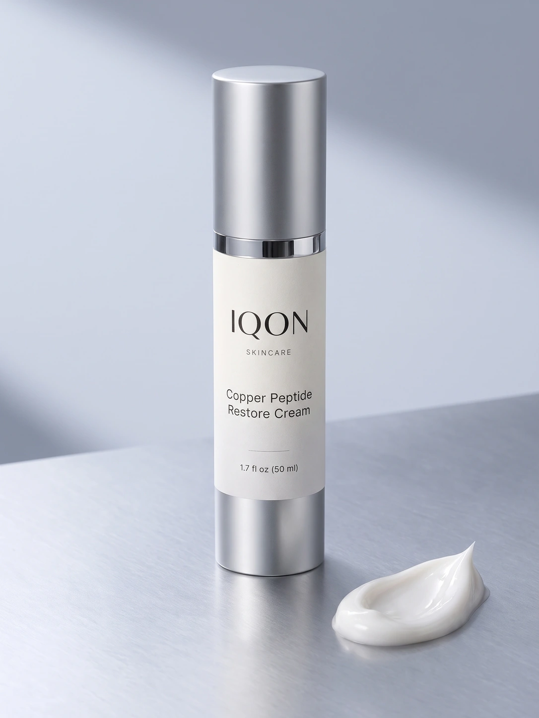 IQON Copper Peptide Restore Cream bottle beside a cream texture detail